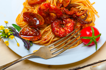 Image showing Italian seafood spaghetti pasta on red tomato sauce