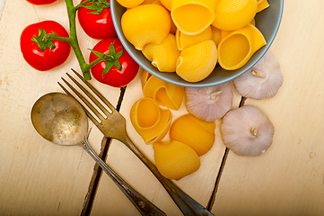 Image showing Italian snail lumaconi pasta with tomatoes