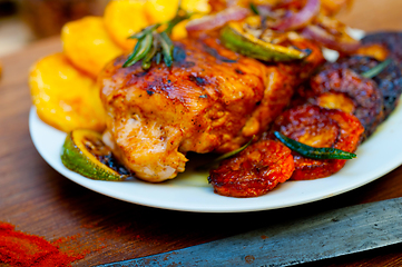 Image showing roasted grilled BBQ chicken breast with herbs and spices