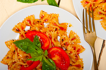 Image showing Italian pasta farfalle butterfly bow-tie and tomato sauce