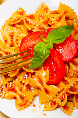 Image showing Italian pasta farfalle butterfly bow-tie and tomato sauce