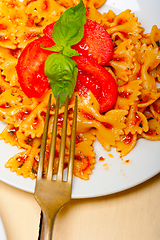 Image showing Italian pasta farfalle butterfly bow-tie and tomato sauce