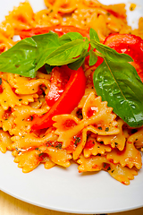 Image showing Italian pasta farfalle butterfly bow-tie and tomato sauce