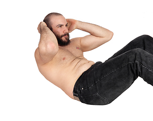 Image showing Man doing stomach crunches in the studio