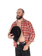 Image showing Young man with open shirt and cowboy hat