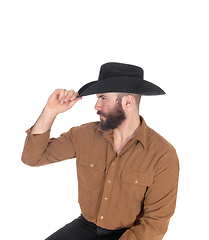 Image showing Handsome man in brown shirt and black cowboy hat