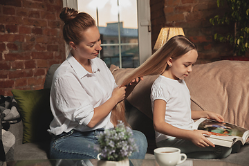 Image showing Mother and daughter during self-insulation at home while quarantined, family time cozy and comfort