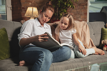 Image showing Mother and daughter during self-insulation at home while quarantined, family time cozy and comfort