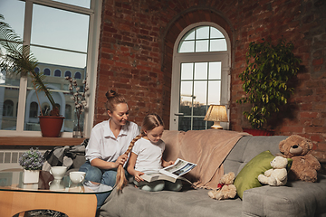 Image showing Mother and daughter during self-insulation at home while quarantined, family time cozy and comfort