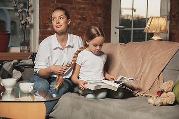 Image showing Mother and daughter during self-insulation at home while quarantined, family time cozy and comfort