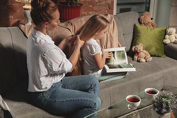 Image showing Mother and daughter during self-insulation at home while quarantined, family time cozy and comfort