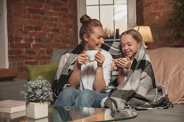 Image showing Mother and daughter during self-insulation at home while quarantined, family time cozy and comfort