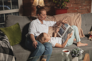 Image showing Mother and daughter during self-insulation at home while quarantined, family time cozy and comfort