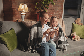 Image showing Mother and daughter during self-insulation at home while quarantined, family time cozy and comfort