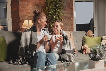 Image showing Mother and daughter during self-insulation at home while quarantined, family time cozy and comfort