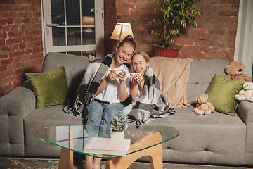 Image showing Mother and daughter during self-insulation at home while quarantined, family time cozy and comfort