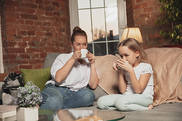 Image showing Mother and daughter during self-insulation at home while quarantined, family time cozy and comfort