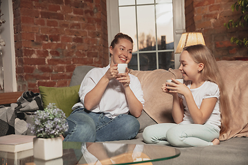 Image showing Mother and daughter during self-insulation at home while quarantined, family time cozy and comfort