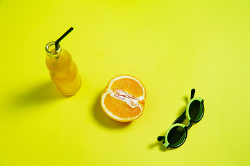 Image showing Monochrome stylish composition in yellow color. Top view, flat lay.