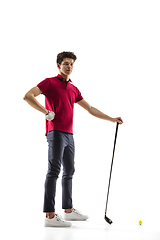 Image showing Golf player in a red shirt training, practicing isolated on white studio background