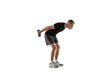 Image showing Young caucasian male model in action, motion isolated on white background. Concept of sport, movement, energy and dynamic, healthy lifestyle. Training, practicing.