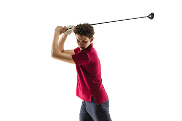 Image showing Golf player in a red shirt taking a swing isolated on white studio background