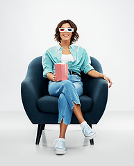 Image showing woman in 3d movie glasses with popcorn in chair