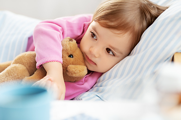 Image showing little girl lying in bed at home