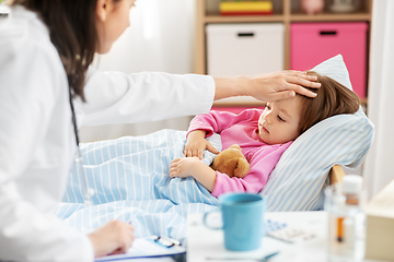 Image showing doctor measuring sick girl's temperature at home