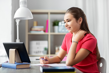 Image showing student girl with tablet pc learning at home