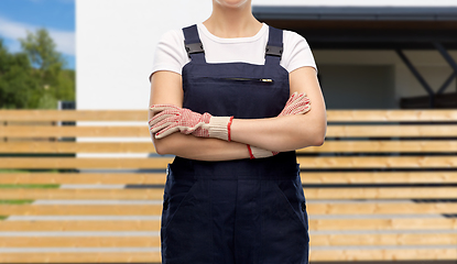 Image showing close up of female painter or builder in overall