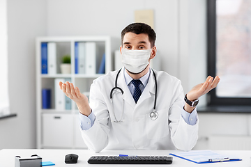 Image showing male doctor having video conference at hospital