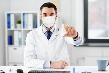 Image showing smiling male doctor with medicine at hospital