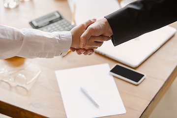 Image showing Close up of caucasian human hands, shaking, working in office, business, people