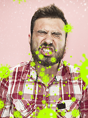 Image showing Caucasian man sneezing, illustration of virus spreading, stop epidemic of coronavirus