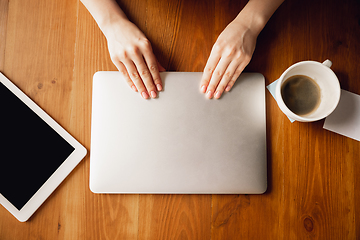 Image showing Close up of caucasian female hands during working in office, studying, top view