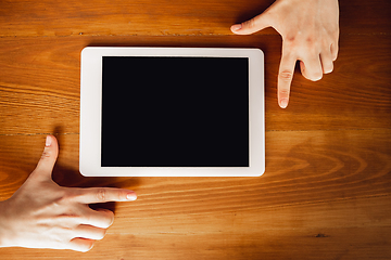 Image showing Close up of caucasian female hands during working in office, studying, top view