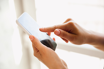 Image showing Close up of caucasian female hands during working in office, studying