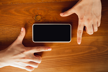 Image showing Close up of caucasian female hands during working in office, studying, top view