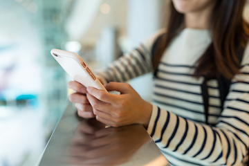 Image showing Woman use of mobile phone in shopping mall