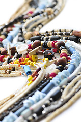 Image showing Wood and seashell bead necklaces