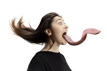 Image showing Smiling girl opening her mouth and showing the long big giant tongue isolated on white background, crazy and attracted