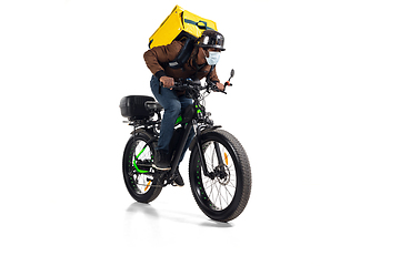 Image showing Too much orders. Contacless delivery service during quarantine. Man delivers food and shopping bags during isolation, wearing helmet and face mask.