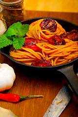 Image showing italian spaghetti pasta and tomato with mint leaves