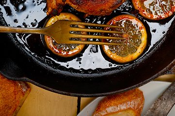 Image showing pork chop seared on iron skillet