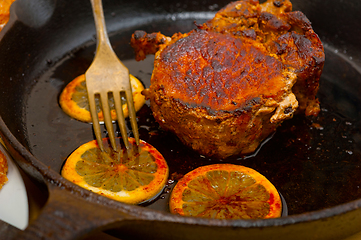 Image showing pork chop seared on iron skillet