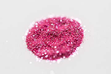 Image showing pink glitters on white background