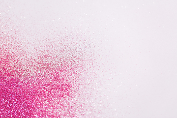 Image showing pink glitters on white background