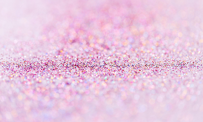 Image showing multicolored glitters on white background