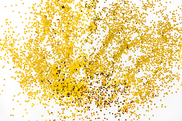 Image showing golden glitters on white background